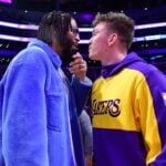 Dallas Mavericks forward Anthony Davis (left) reacts with Los Angeles Lakers guard Dalton Knecht (right)