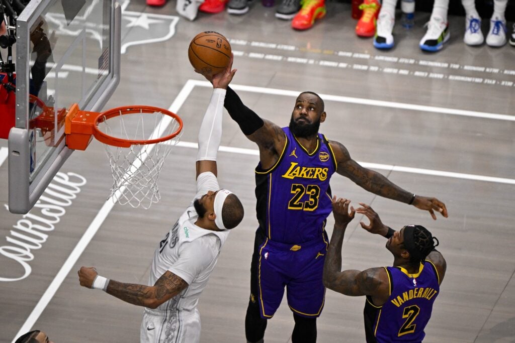 Apr 9, 2025; Dallas, Texas, USA; Dallas Mavericks center Daniel Gafford (21) and Los Angeles Lakers forward LeBron James (23) battle for the rebound during the first quarter at the American Airlines Center. Mandatory Credit: Jerome Miron-Imagn Images