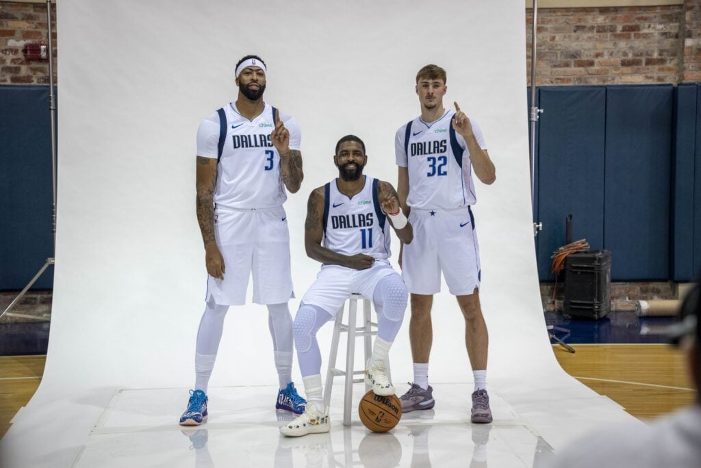 Sep 29, 2025; Dallas, TX, USA; Dallas Mavericks forward Anthony Davis (3) and guard Kyrie Irving (11) and forward Cooper Flagg (32) pose for a photo during the Mavericks 2025 media day at the American Airlines Center. Mandatory Credit: Jerome Miron-Imagn Images
